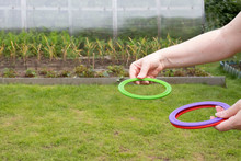 Children's Play Ring Toss On Green Grass