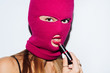 © Lucas Ottone/Stocksy - Masked woman with lipstick