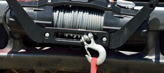 Cable on emergency vehicle winch with heavy hook