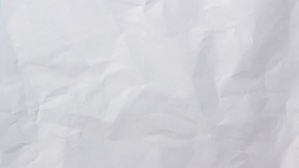 Wall Mural - white crumpled paper background texture. stop motion animation. seamless looping.