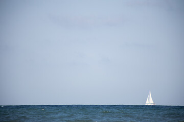 white sailing ship in sea