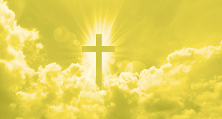 Wall Mural - Christian cross appears bright in the yellow sky