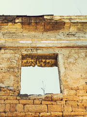 Wall Mural - Mystical Interior, ruins of facade of an abandoned ruined building of an ancient castle 18th century. Old ruined walls, corridor with garbage and mud. Ruins Ancient historic building destroyed by war