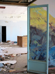 Wall Mural - Old furniture scattered around the room. Interior details inside the destroyed house of culture. The interior of the dying abandoned cinema room.