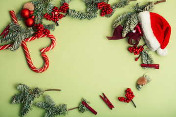 Wall Mural - christmass stuff laying flat on colorful background, branch of tree, balls, candy