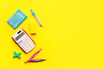 Composition with calculators on color background