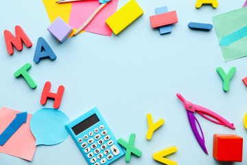 Composition with word MATH and stationery on color background