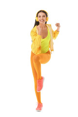 Wall Mural - Young woman doing aerobics on white background