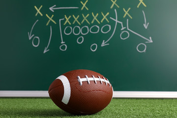 Wall Mural - Rugby ball and scheme of football game drawn on chalkboard