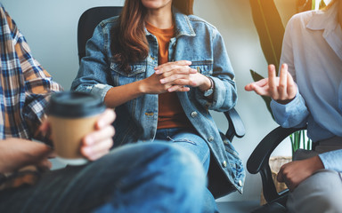 Canvas Print - A group of young people sitting and talking together