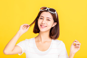 Wall Mural - Close up  of stylish young woman in sunglasses smiling