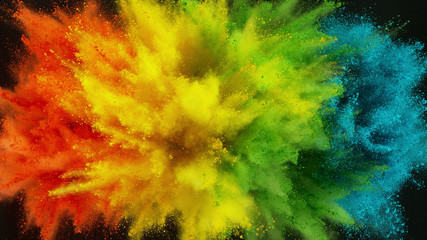Wall Mural - Colorful powder explosion isolated on black background