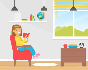 Canvas Print - Cute Smiling Girl Reads Book Sitting in Armchair Near the Window Cartoon Vector Illustration