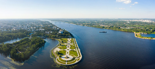 Wall Mural - Tourist spot of Strelka Park on the Yaroslavl embankment and a view from the height of the Assumption Cathedral in Yaroslavl against the background of a summer sunset