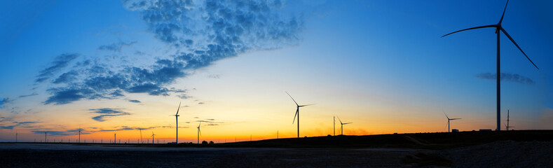 Wall Mural - wind farm panorama at sunset