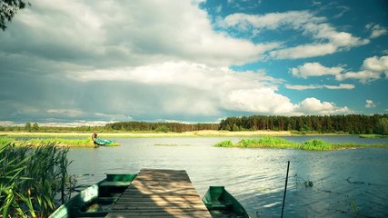 Wall Mural - Old Wooden Fishing Boat Near Pier In Summer Lake Or River. Beautiful Summer Sunny Day Or Evening. Forsaken Boat. Russian Nature