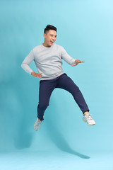 Wall Mural - Portrait of attractive trendy hurry move motion energy vacation holiday scream shout crazy isolated blue background