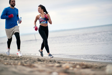 Wall Mural - Couple training together; Healthy lifestyle concept