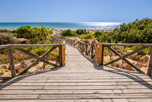 Wooden Walkway That Gives Access To La Barrosa Beach In Sancti Petri, Cadiz