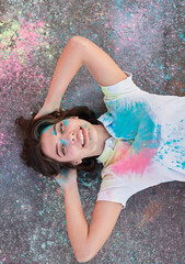 Wall Mural - Happy young female covered with paint