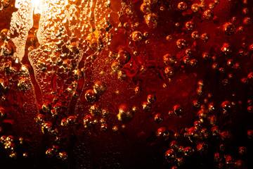 Ice cube in whiskey texture background, macro close up of Ice cubes in glass of whiskey or another alcohol,Crystal design