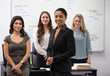 © Tetra Images - Businesswomen smiling in office