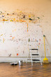 © Tetra Images - Paint splattered on wall at home