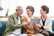 © View Stock - Happy old people watching tablet