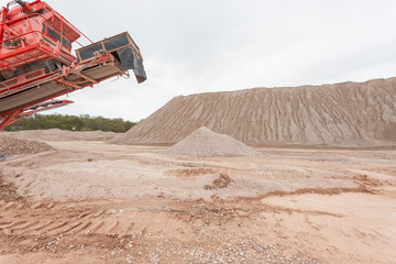 Wall Mural - Crushing machinery working on the open pit quarry