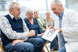 © Westend61 - Group of seniors attending health counselling in retirement home