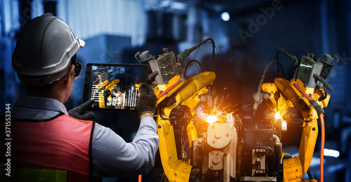 Cuadros en Lienzo Smart industry robot arms for digital factory production technology showing automation manufacturing process of the Industry 4