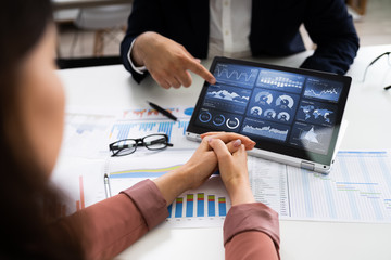Poster - Financial Analyst Using Convertible Laptop Screen