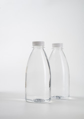 Sticker - fresh liquid food product on blank plastic container bottle mockup