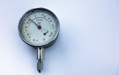 Metal pressure gauge on white isolate