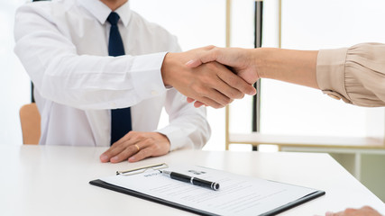 Wall Mural - Two confident business man shaking hands during a meeting in the office, success, dealing, greeting and partner concept