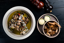 Clams And Bread With Sauce Top View