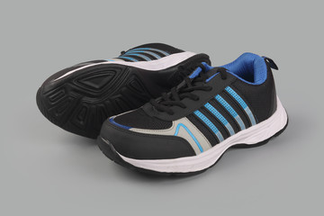 Indian made men's Sports Shoes on gray background