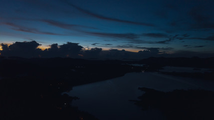 Aerial view of Kenyir Lake during blue hour sunrise.