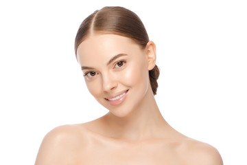 portrait of young attractive smiling brown-eyed woman with naturally glowing skin, isolated on white