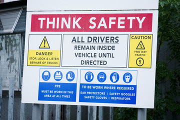 Wall Mural - Construction site health and safety message rules sign board signage on fence boundary