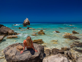 Wall Mural - Woman at the beach in Greece