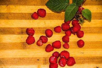 raspberries on wooden background