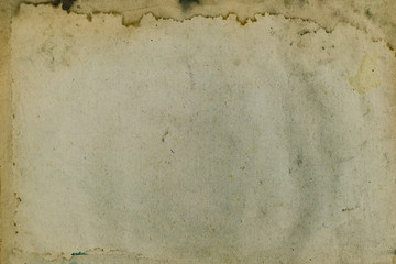 Aging, worn paper with water stains and rough edges