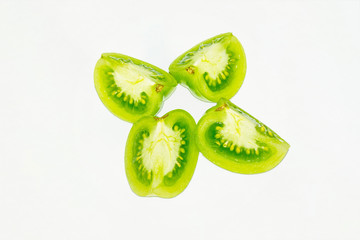 Green tomatoes over white isolated background.top