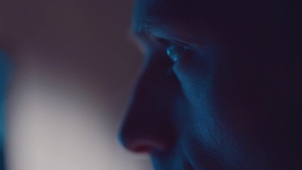 Man working at computer in home office at night