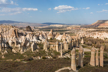 Wall Mural - Volcanic rock formations known as Fairy Chimneys in Love Valley, Cappadocia, Turkey