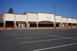 © Tada Images - An out-of-business retail place with its empty parking lot in Portland, Oregon, during a pandemic summer.