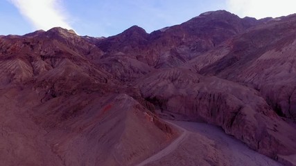 Wall Mural - Hiking trail in the canyon. Red hills of Death Valley, California