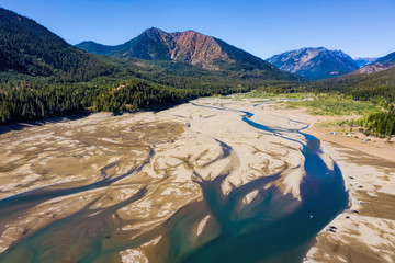 lake in the mountains with streams and sand