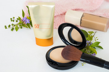 pressed powder ,sunscreen spf50 ,foundation cosmetics beauty makeup of colorful lifestyle woman relax summer arrangement flat lay style on background white wooden